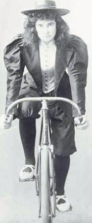 Bicycle rider with a bustle dress